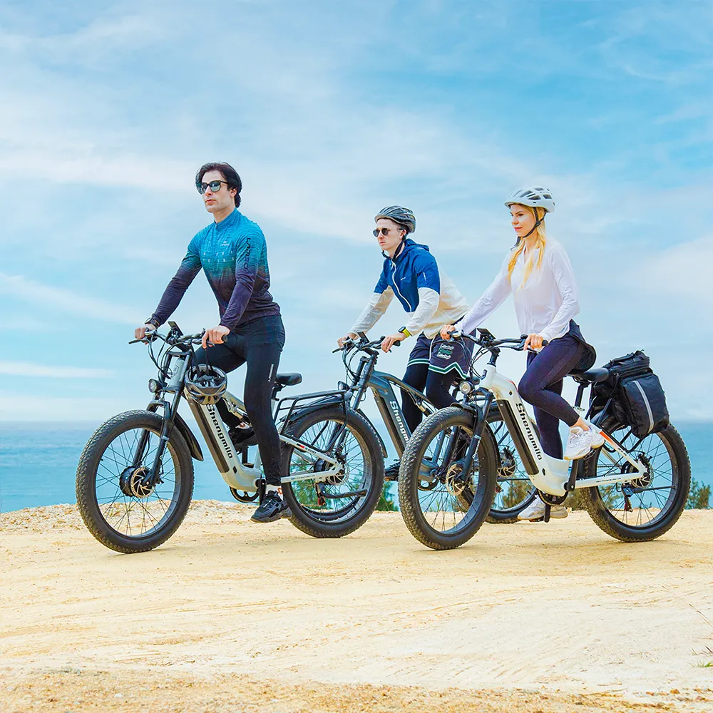 Shengmilo MX05 - vélo électrique tout-terrain avec hommes et femmes en train de rouler ensemble sur chemin de randonnée